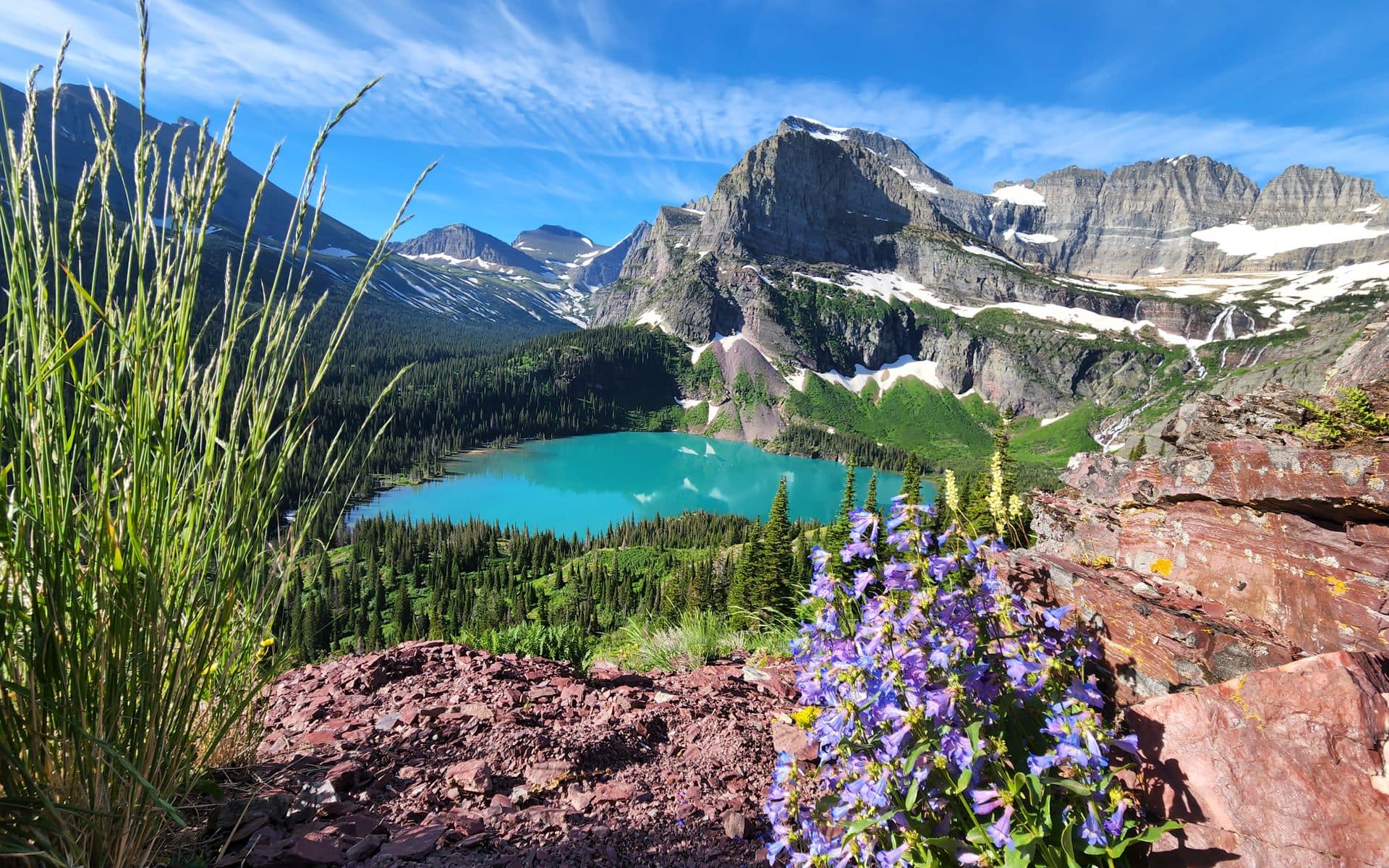 Mountain peaks reflected in a lake in Glacier National Park, Montana